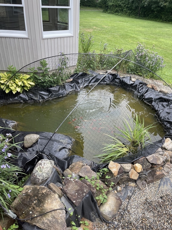 43 Tower Hill Road Brimfield, MA 01010 - Photo 36 of 36 a view of a backyard with plants and lake view