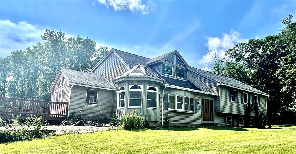 43 Tower Hill Road Brimfield, MA 01010 - Photo 4 of 36 a front view of a house with a yard