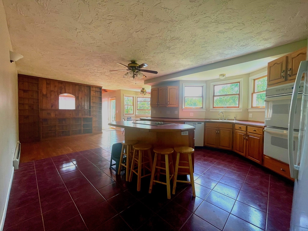 43 Tower Hill Road Brimfield, MA 01010 - Photo 9 of 36 a kitchen with stainless steel appliances granite countertop a sink and cabinets