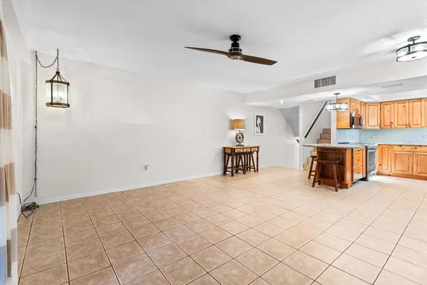 a view of a livingroom with furniture and a flat screen tv