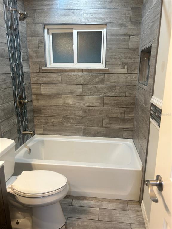501 Firefly Lane Apollo Beach, FL 33572 - Photo 13 of 17 a bathroom with a toilet and a bathtub