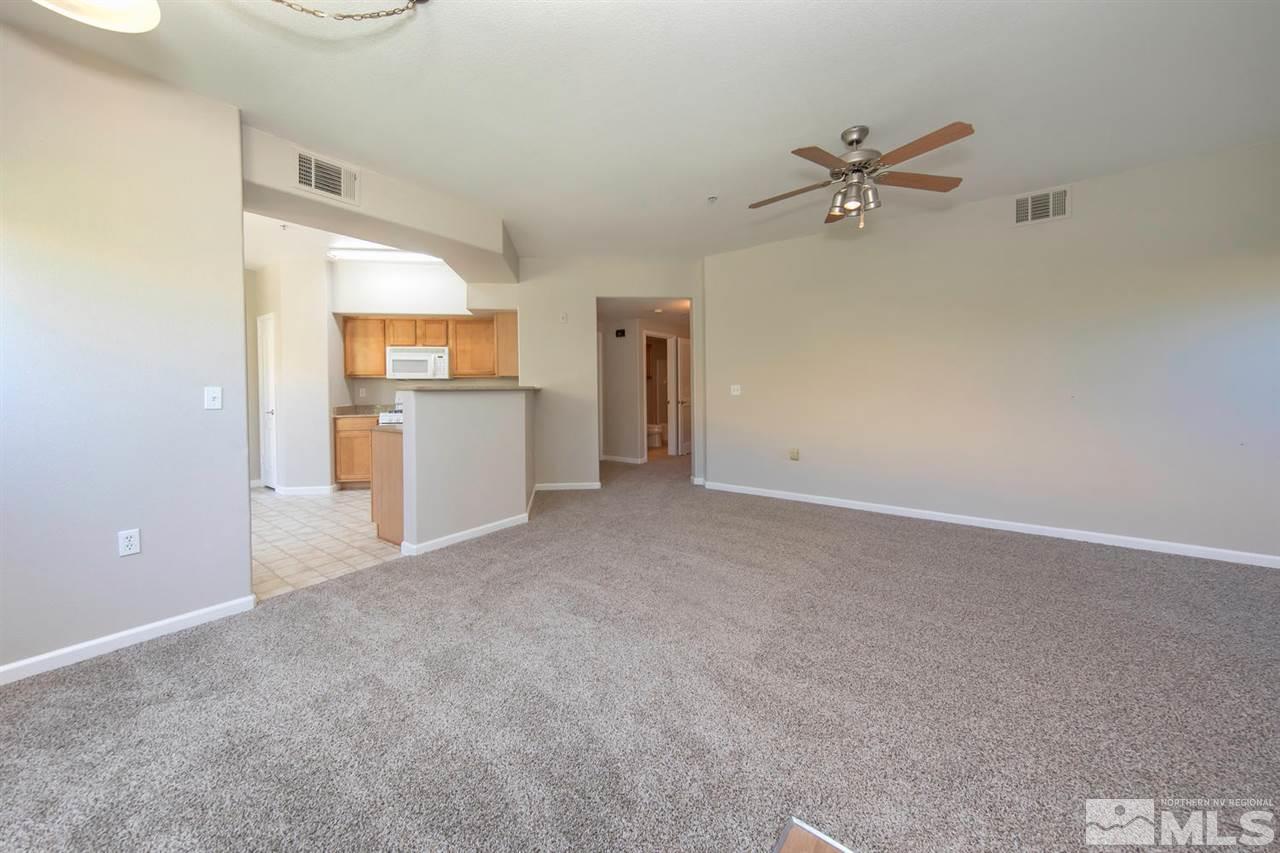 9050 Double R Boulevard, Unit 911 Reno, NV 89521 - Photo 8 of 22 a view of a kitchen with a dishwasher and a refrigerator