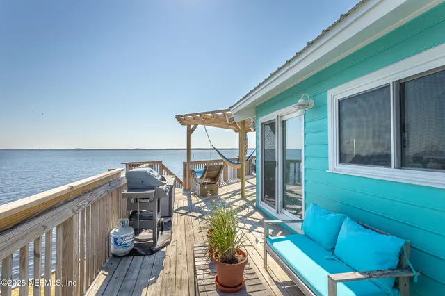a view of swimming pool with furniture