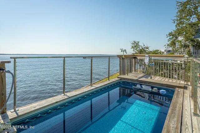 a kitchen with a table chairs refrigerator and microwave