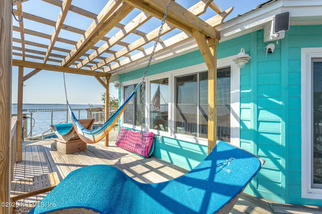 a kitchen with a table chairs stove and cabinets