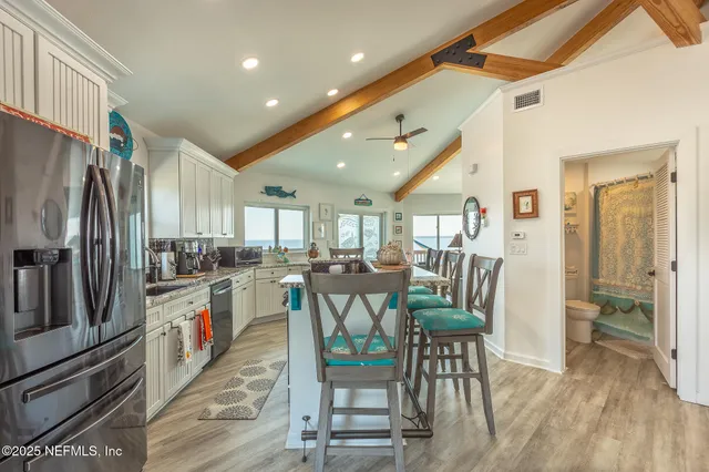 a living room with furniture and a ceiling fan