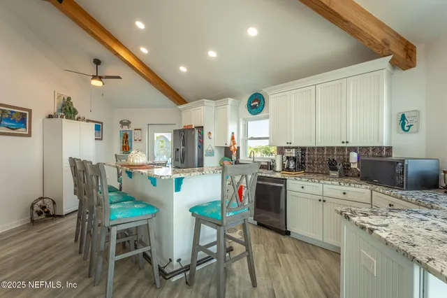 a bathroom with a granite countertop toilet sink and a mirror