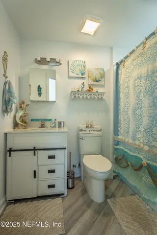 a bedroom with a bed and a closet