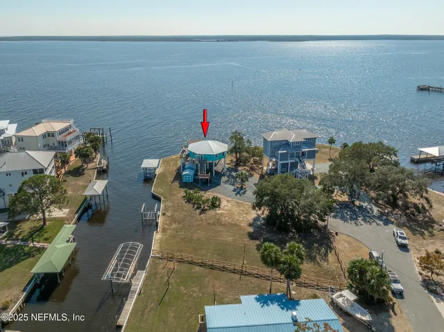 an aerial view of a house with outdoor space