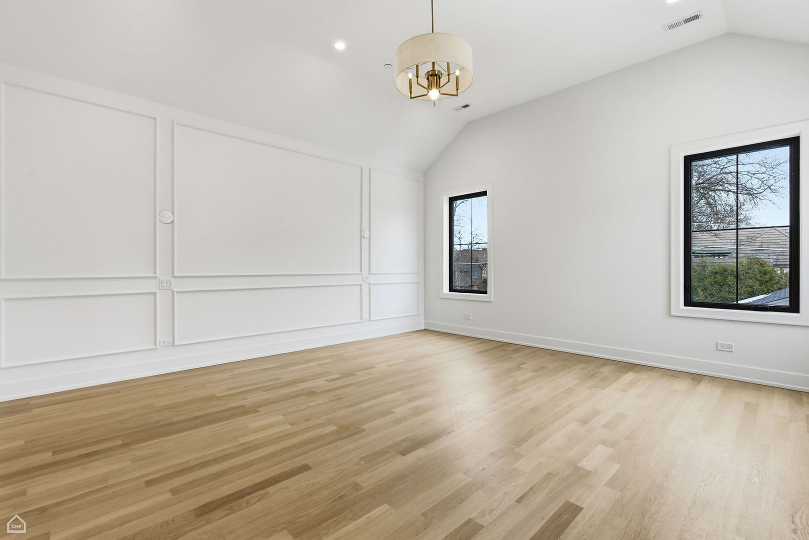 135 Elmore Street Park Ridge, IL 60068 - Photo 12 of 23 an empty room with wooden floor cabinet and windows