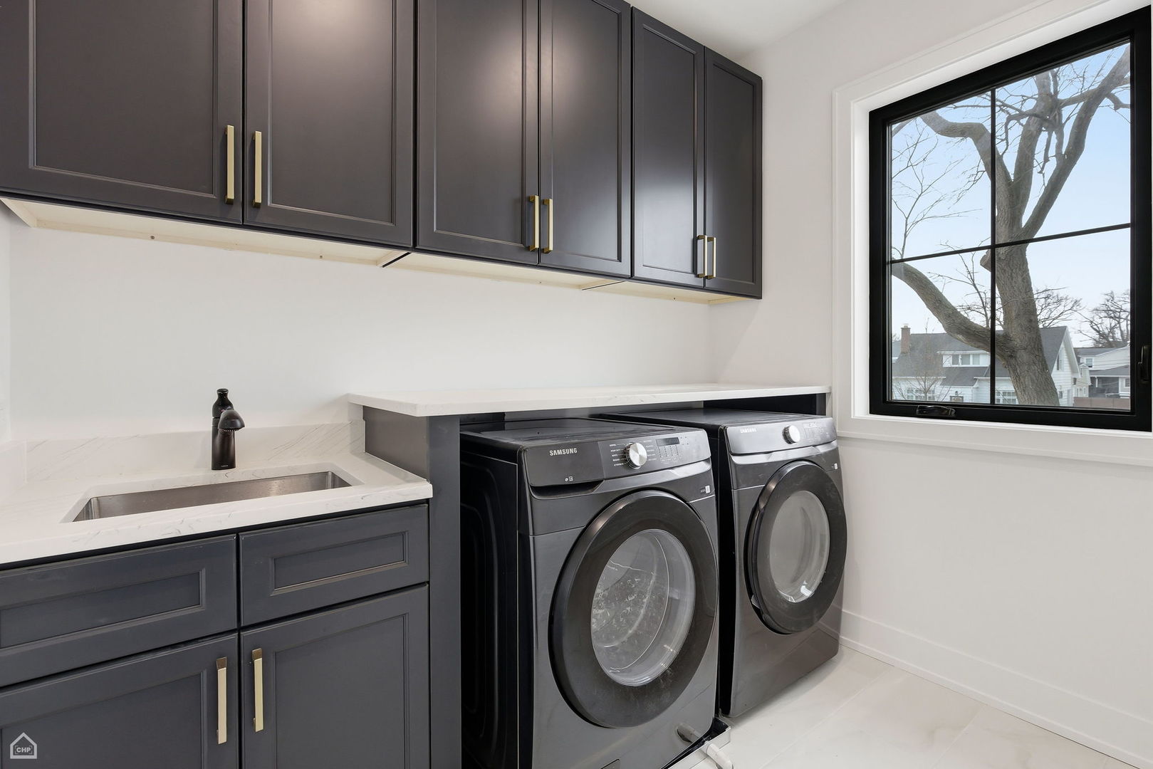 135 Elmore Street Park Ridge, IL 60068 - Photo 18 of 23 a utility room with sink dryer and washer