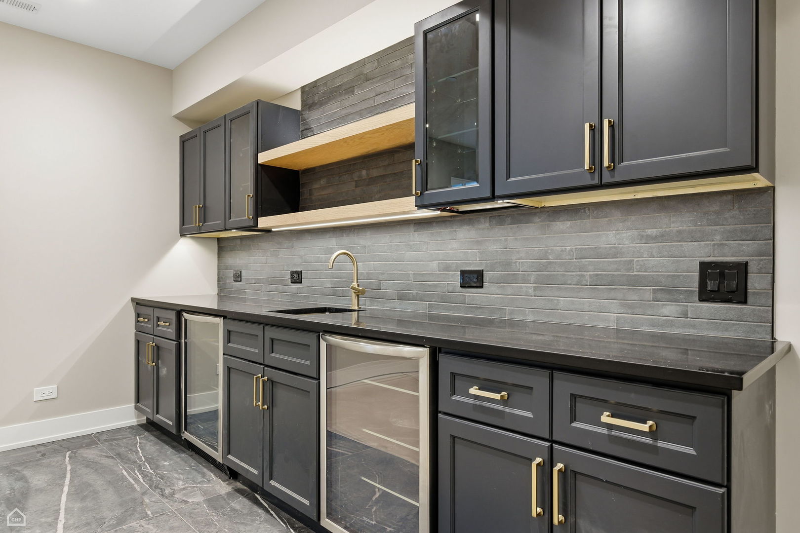 135 Elmore Street Park Ridge, IL 60068 - Photo 19 of 23 a kitchen with stainless steel appliances granite countertop a sink and a microwave