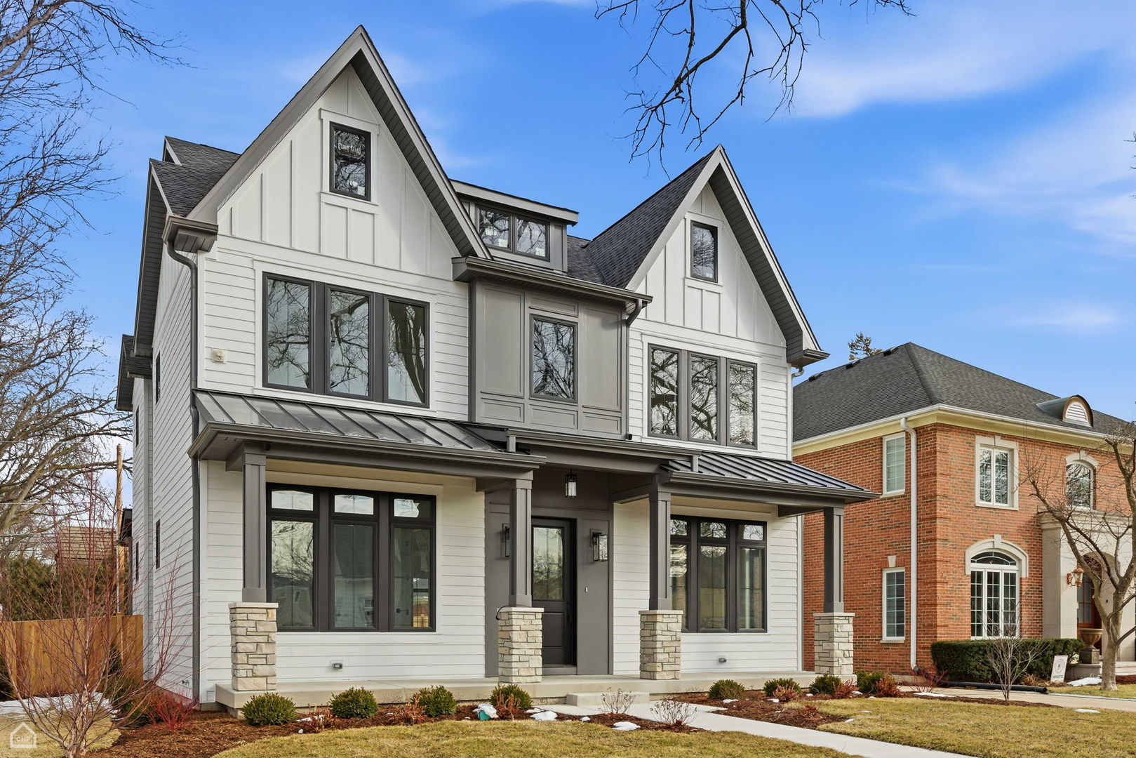 135 Elmore Street Park Ridge, IL 60068 - Photo 2 of 23 a view of a brick house with large windows