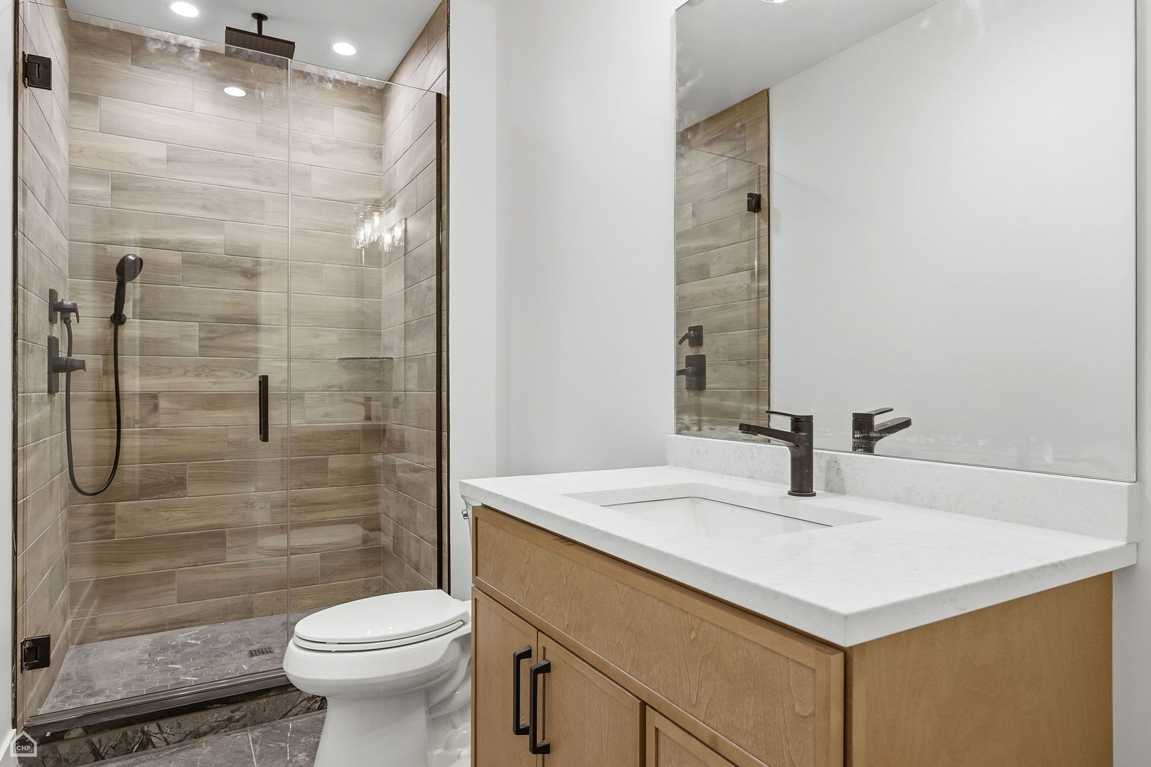 135 Elmore Street Park Ridge, IL 60068 - Photo 22 of 23 a bathroom with a sink toilet vanity and shower