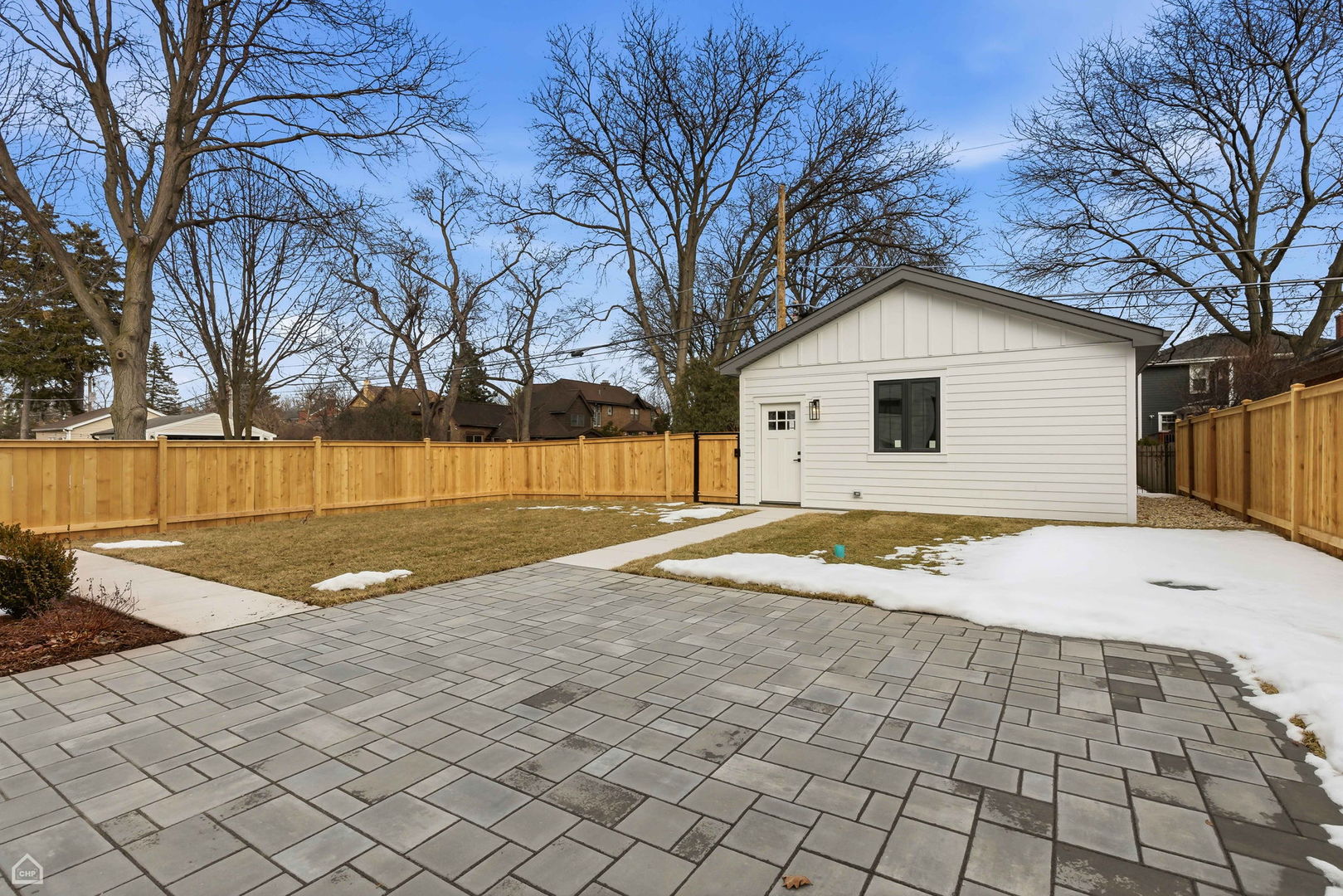 135 Elmore Street Park Ridge, IL 60068 - Photo 23 of 23 a view of a white house with a yard and large trees