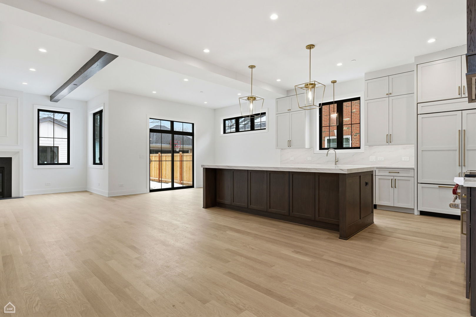 135 Elmore Street Park Ridge, IL 60068 - Photo 5 of 23 a large white kitchen with kitchen island a sink stainless steel appliances and cabinets