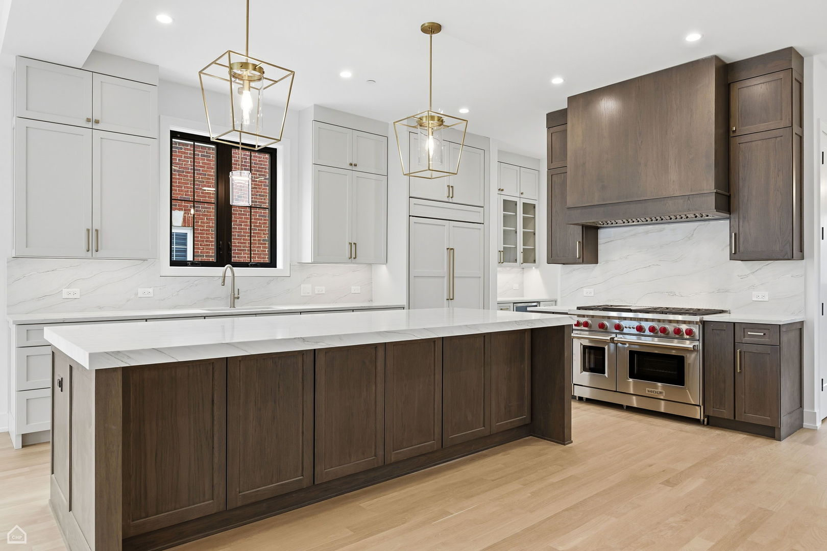 135 Elmore Street Park Ridge, IL 60068 - Photo 6 of 23 a kitchen with stainless steel appliances granite countertop a sink a stove and a refrigerator