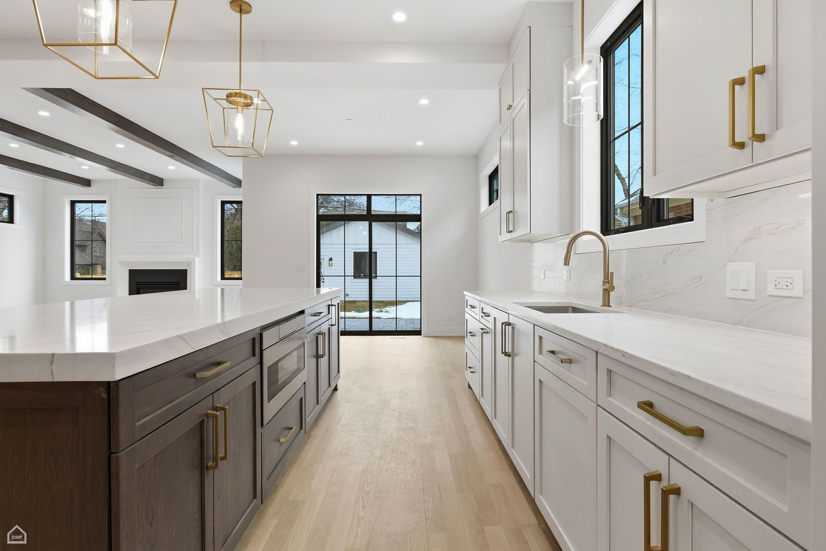 135 Elmore Street Park Ridge, IL 60068 - Photo 7 of 23 a large kitchen with stainless steel appliances lots of counter space and wooden floor