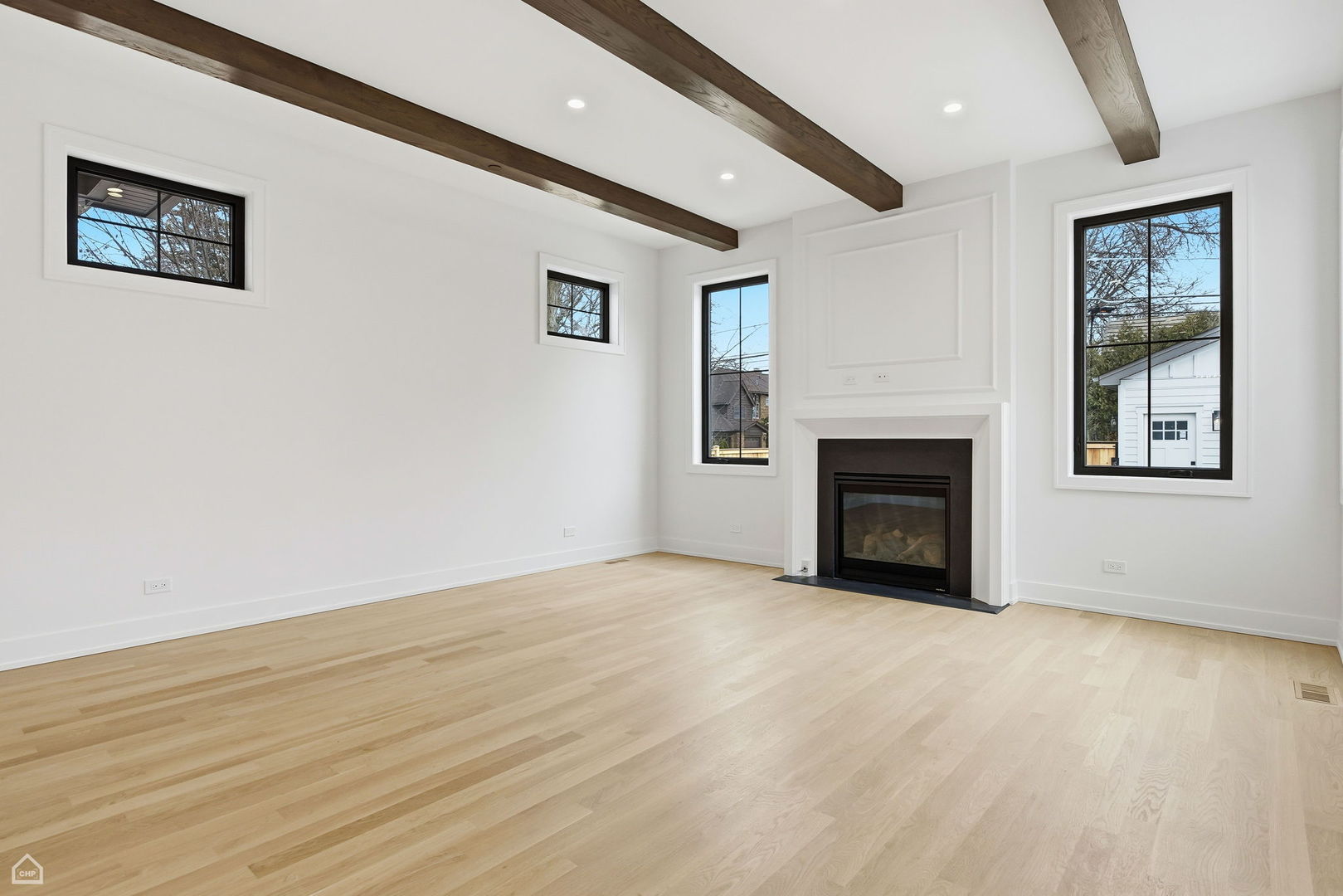135 Elmore Street Park Ridge, IL 60068 - Photo 8 of 23 a view of an empty room with wooden floor and a window