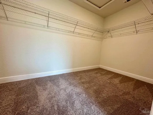 a view of a room with racks on the wall