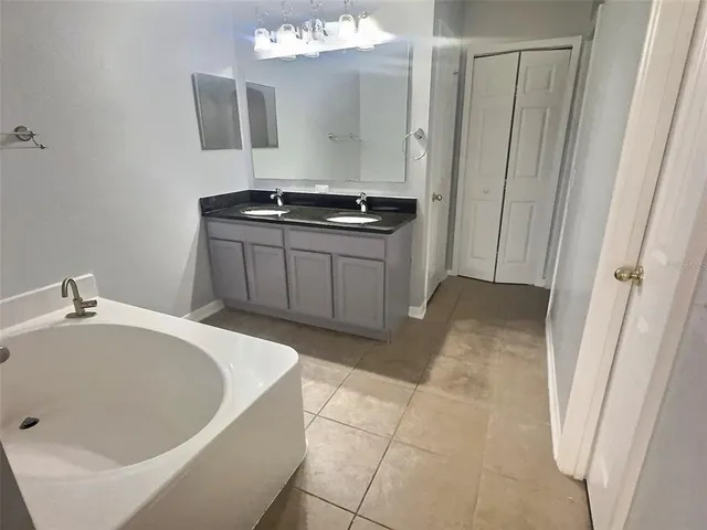 a bathroom with a bathtub and a sink