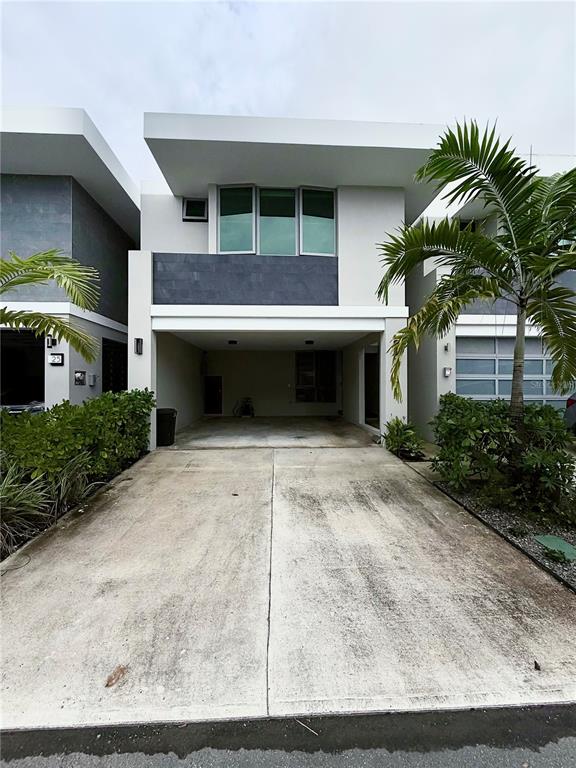Urb Riviera Court Urb Riviera Court Bayamon, PR 00959 - Photo 1 of 1 a front view of a house with a yard and garage
