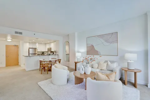 a living room with furniture and a table