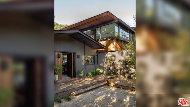 a view of a house with a small yard