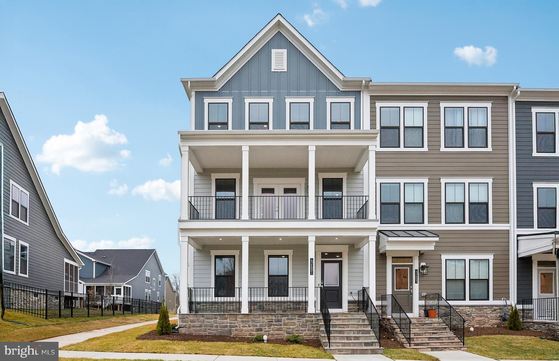 42601 Houdini Rst Terrace Leesburg, VA 20176 - Photo 1 of 52 a front view of a building with a swimming pool