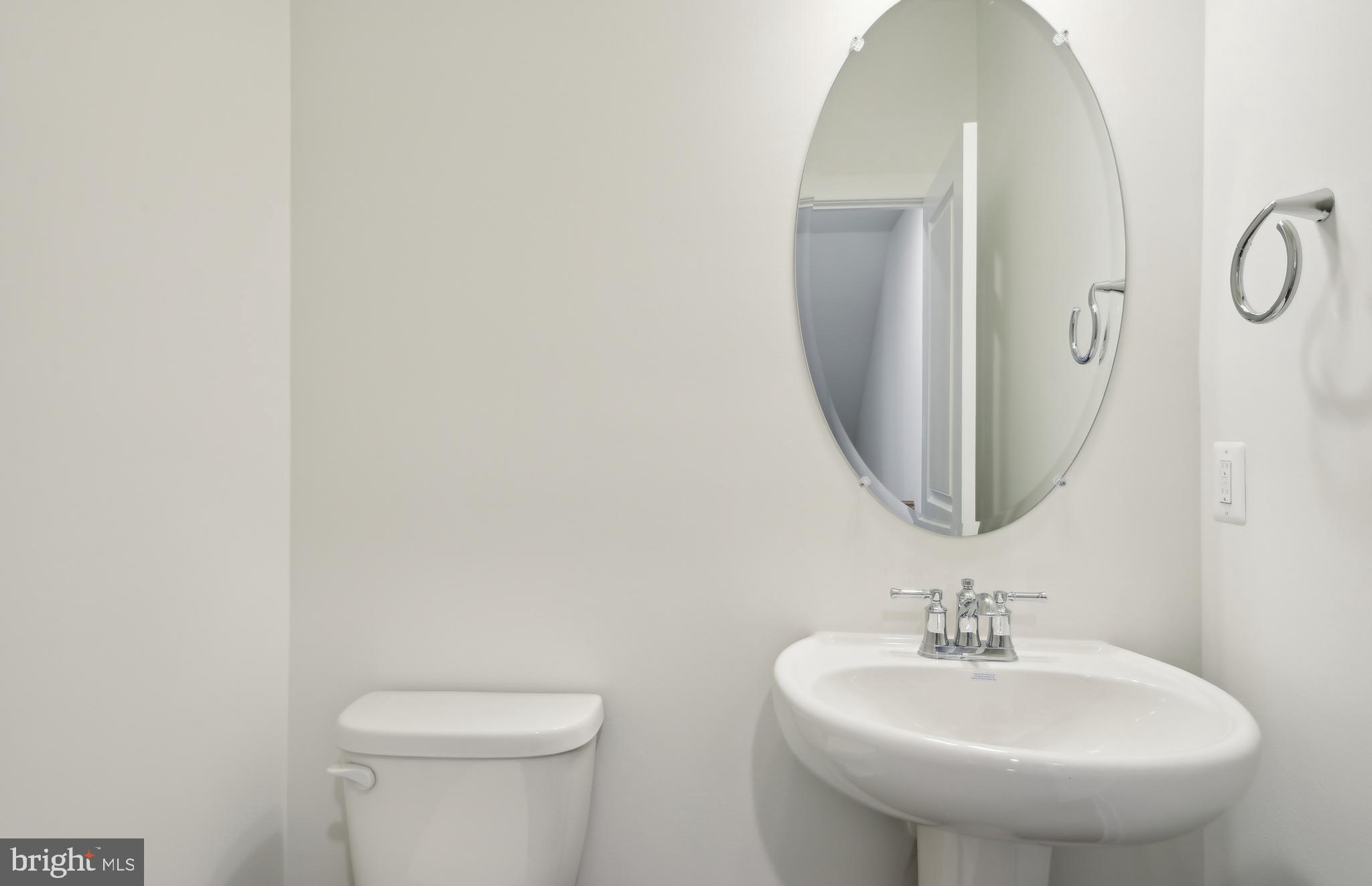 42601 Houdini Rst Terrace Leesburg, VA 20176 - Photo 13 of 52 a bathroom with a toilet sink and mirror