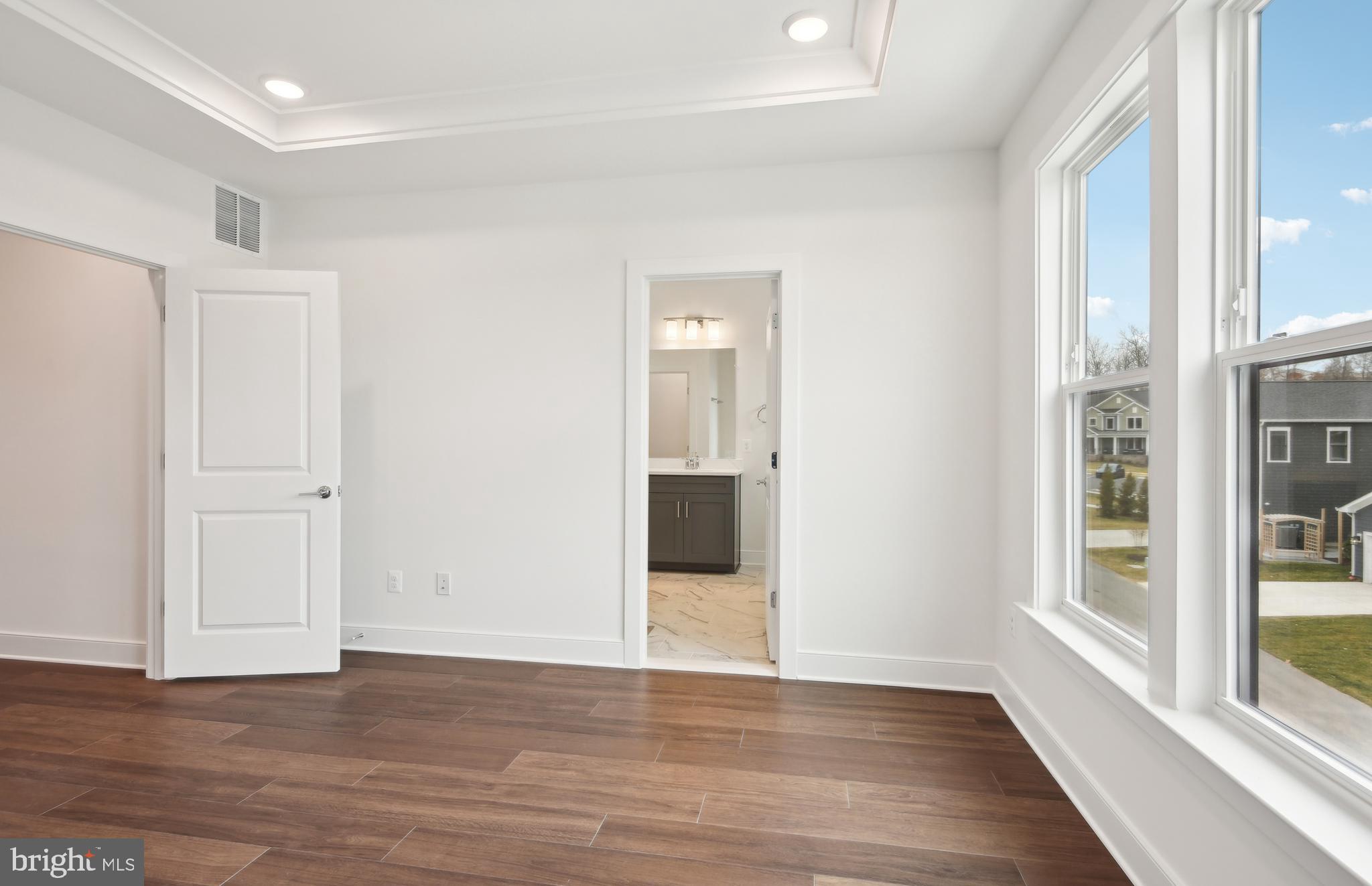 42601 Houdini Rst Terrace Leesburg, VA 20176 - Photo 17 of 52 a view of a big room with wooden floor and windows