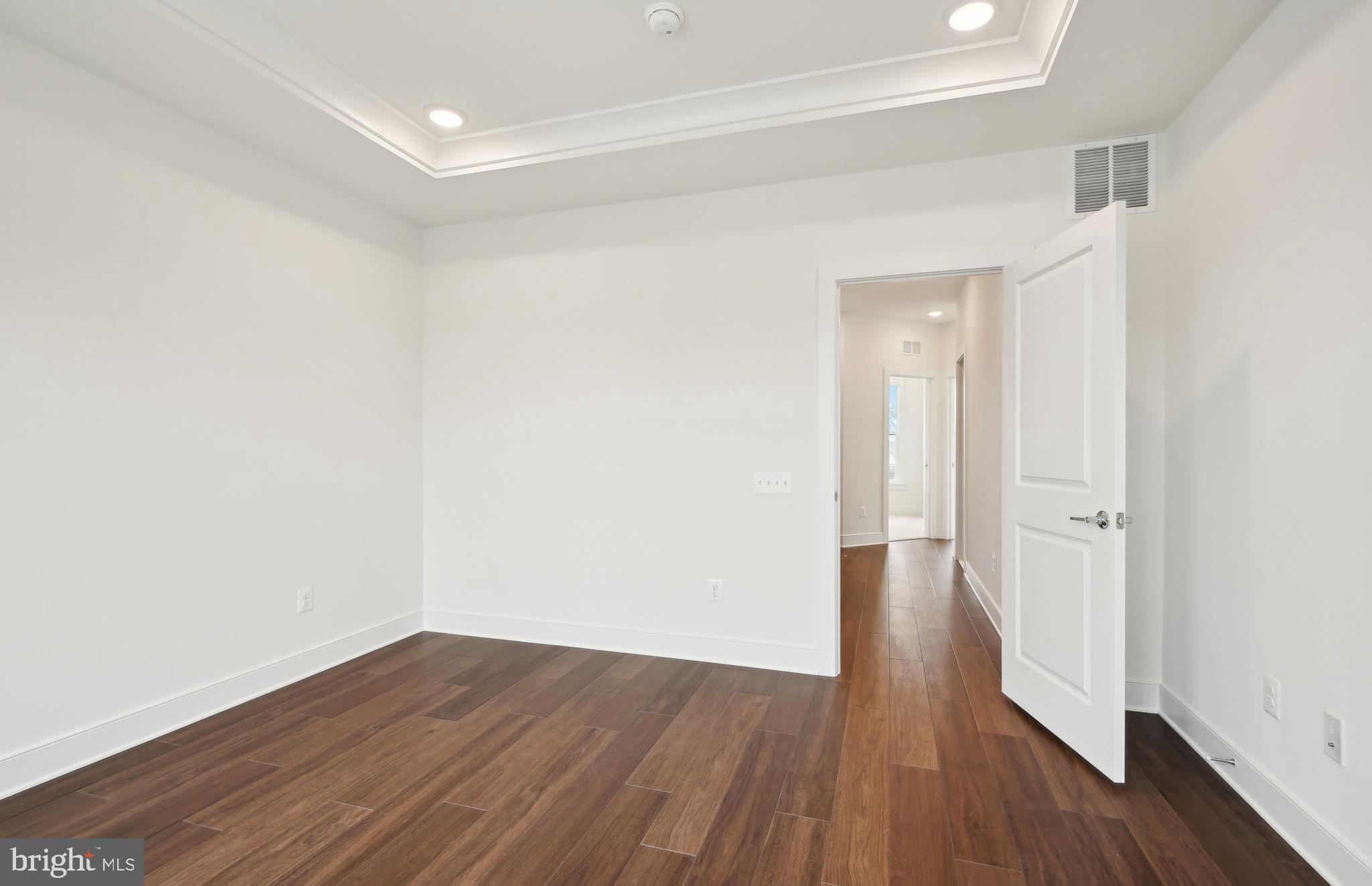 42601 Houdini Rst Terrace Leesburg, VA 20176 - Photo 18 of 52 a view of a hallway with wooden floor