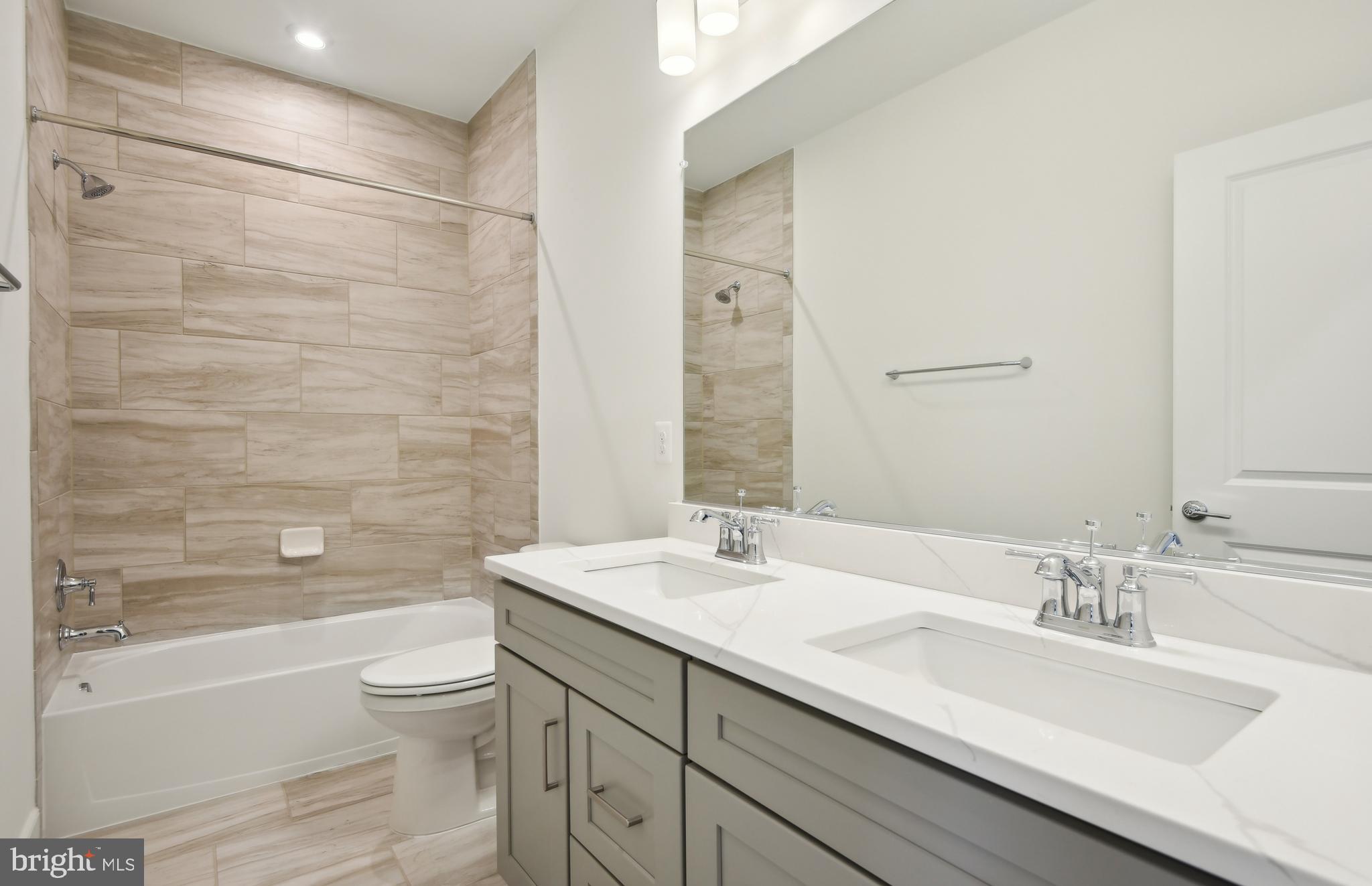 42601 Houdini Rst Terrace Leesburg, VA 20176 - Photo 27 of 52 a bathroom with a sink a toilet and shower