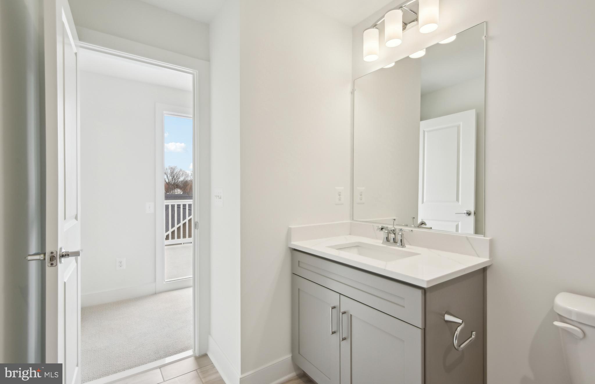 42601 Houdini Rst Terrace Leesburg, VA 20176 - Photo 31 of 52 a bathroom with a sink vanity and a mirror