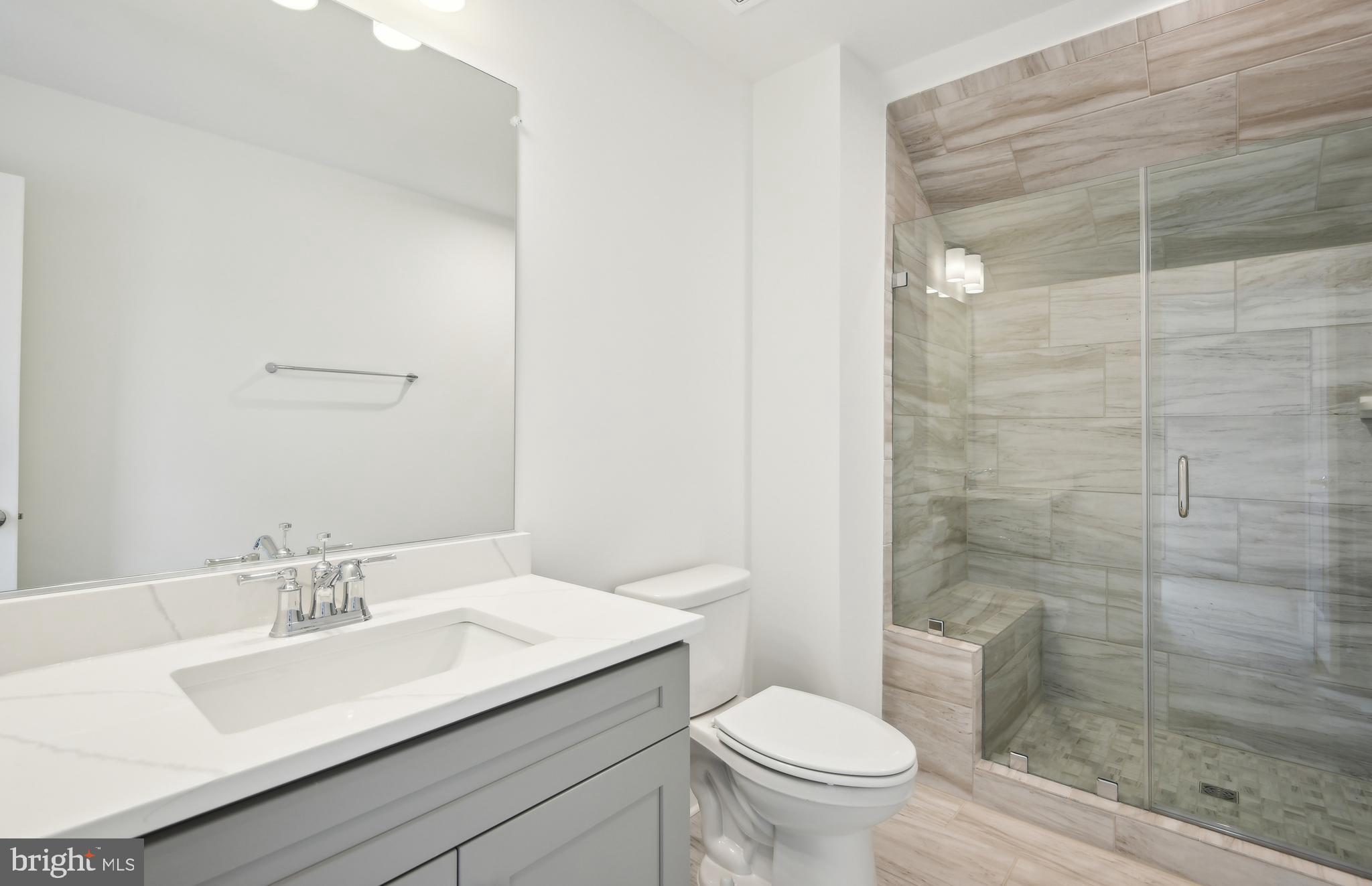 42601 Houdini Rst Terrace Leesburg, VA 20176 - Photo 32 of 52 a bathroom with a sink a toilet and shower