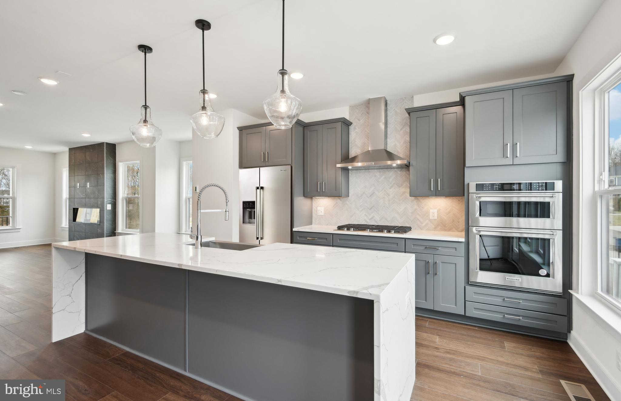 42601 Houdini Rst Terrace Leesburg, VA 20176 - Photo 6 of 52 a kitchen with stainless steel appliances a stove a sink a refrigerator and cabinets