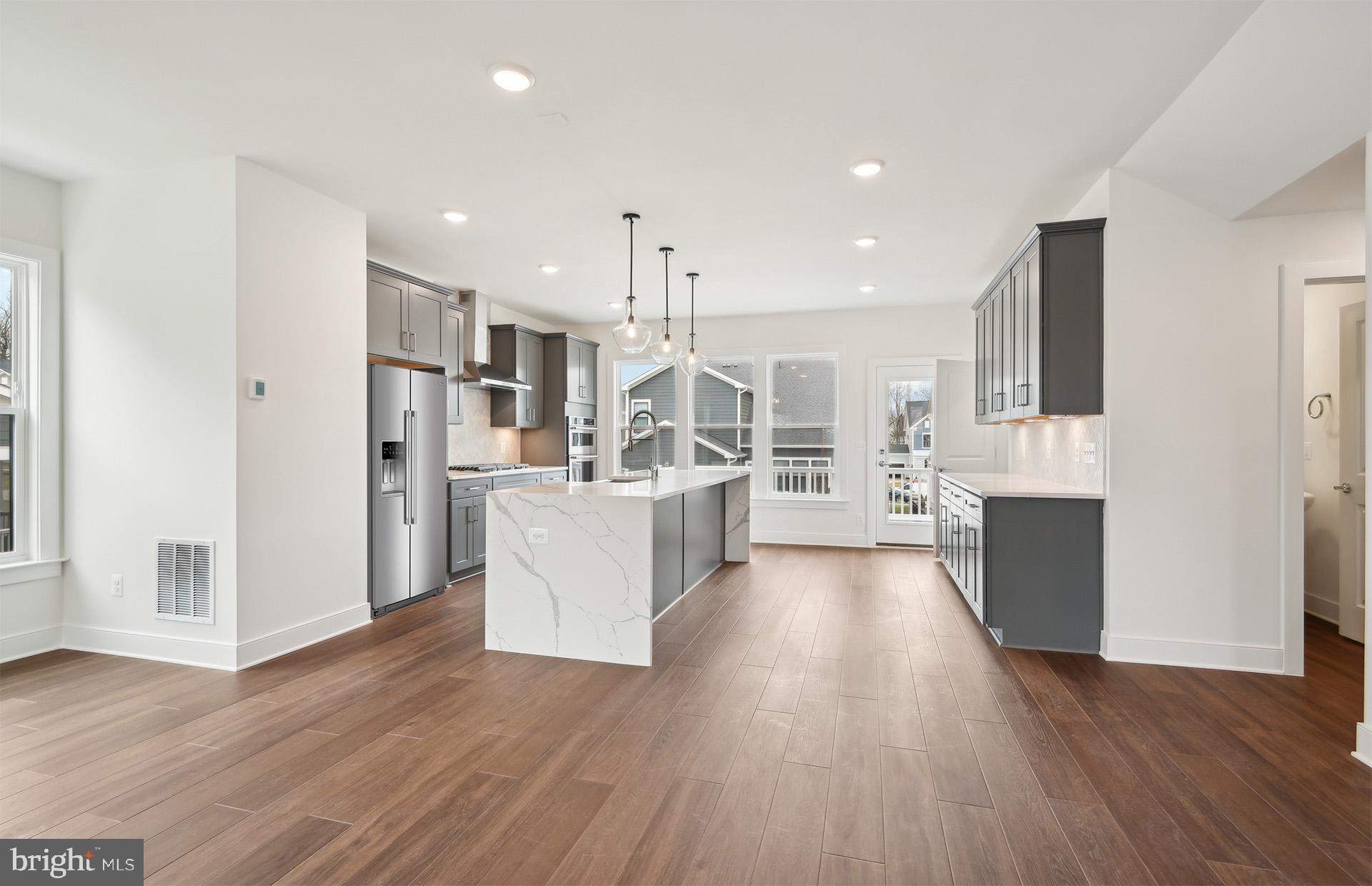 42601 Houdini Rst Terrace Leesburg, VA 20176 - Photo 9 of 52 a large kitchen with a lot of counter space