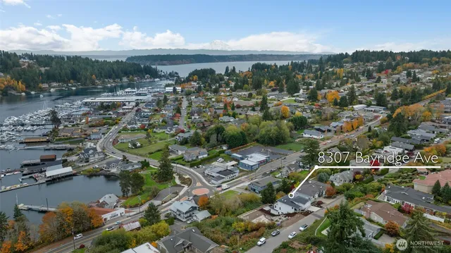 a view of lake with lots of residential buildings in background