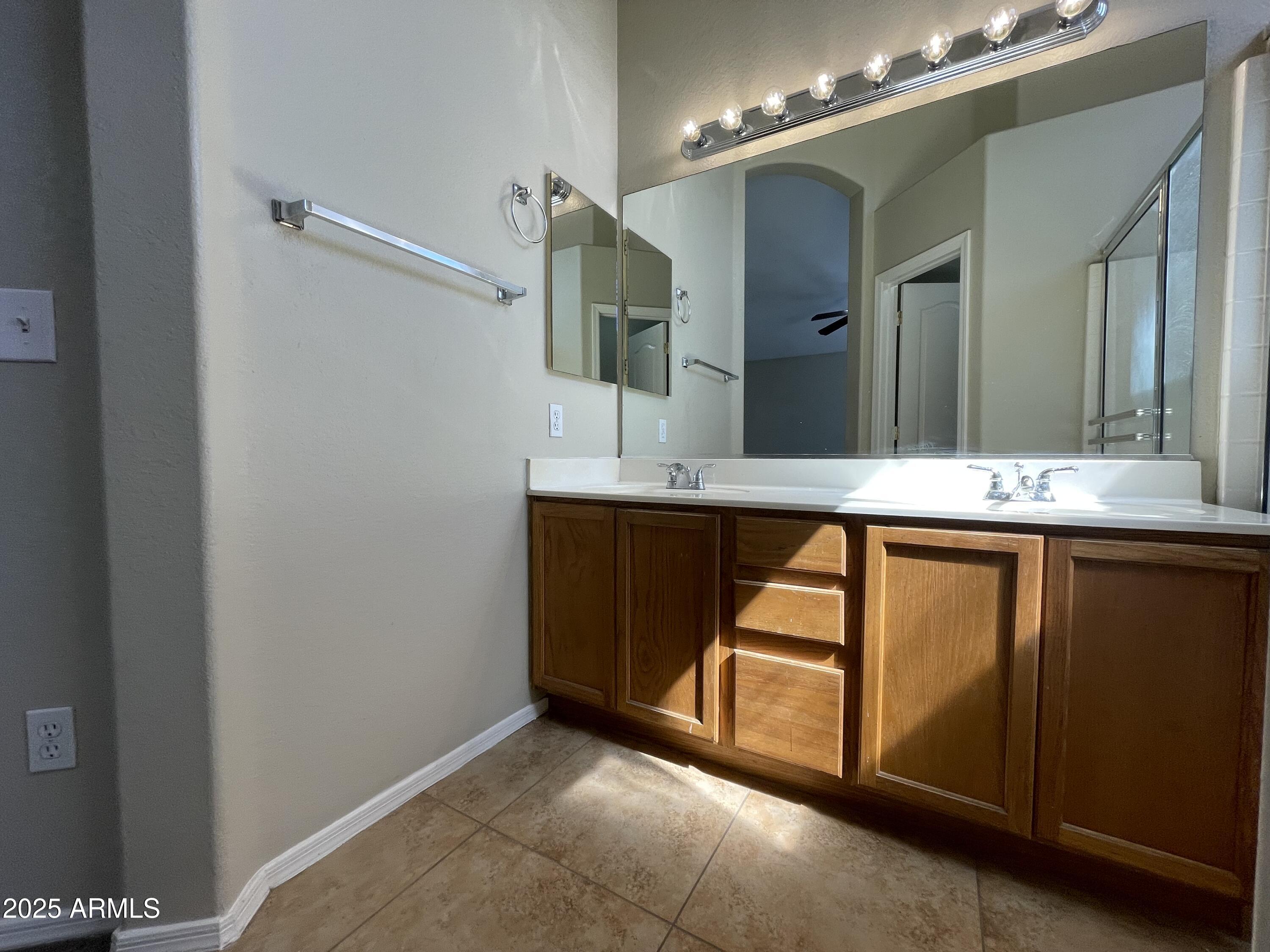 4073 East Princeton Avenue Gilbert, AZ 85234 - Photo 5 of 6 a bathroom with a granite countertop sink and a mirror