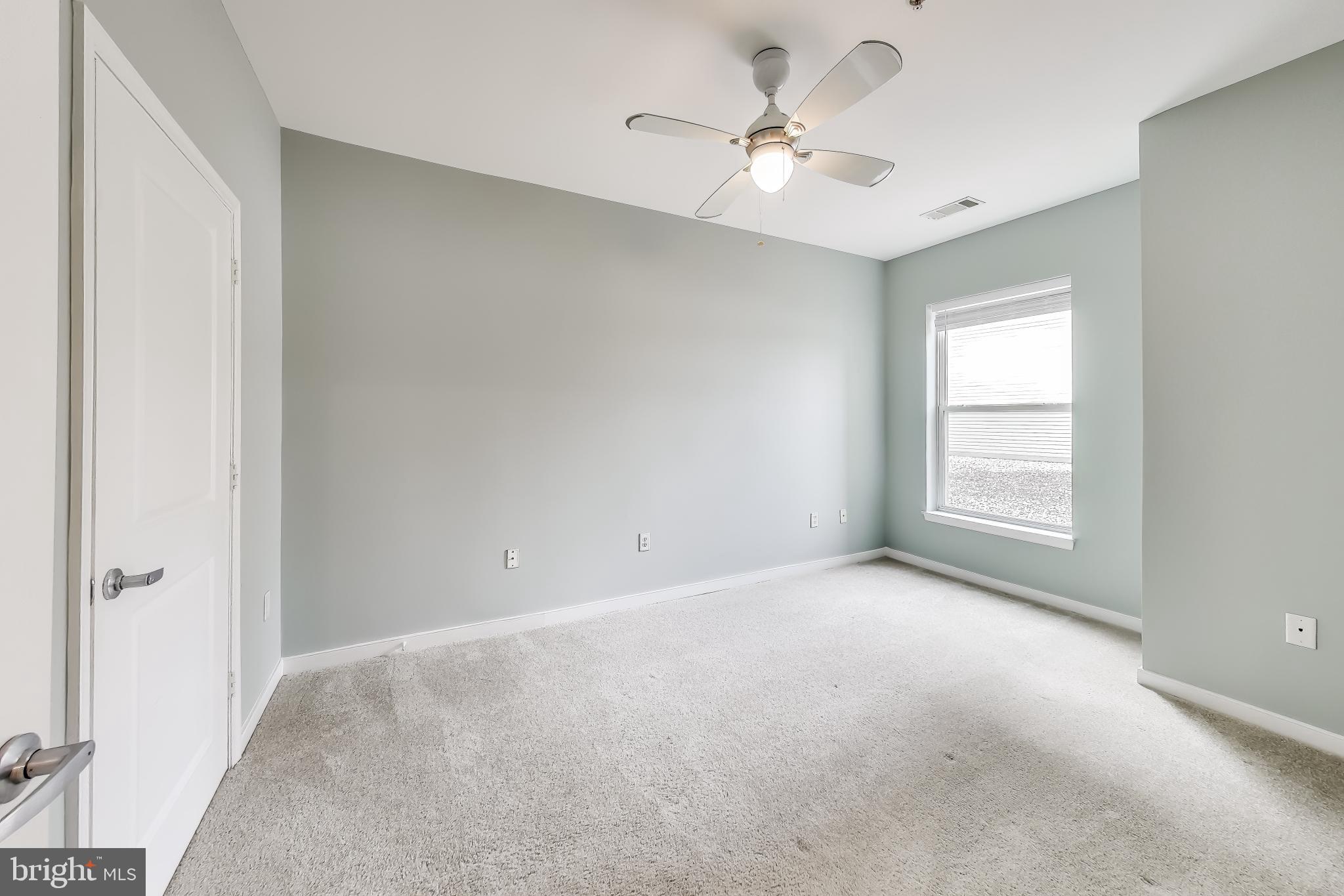 8045 Newell Street, Unit 108 Silver Spring, MD 20910 - Photo 12 of 33 a view of an empty room with a window
