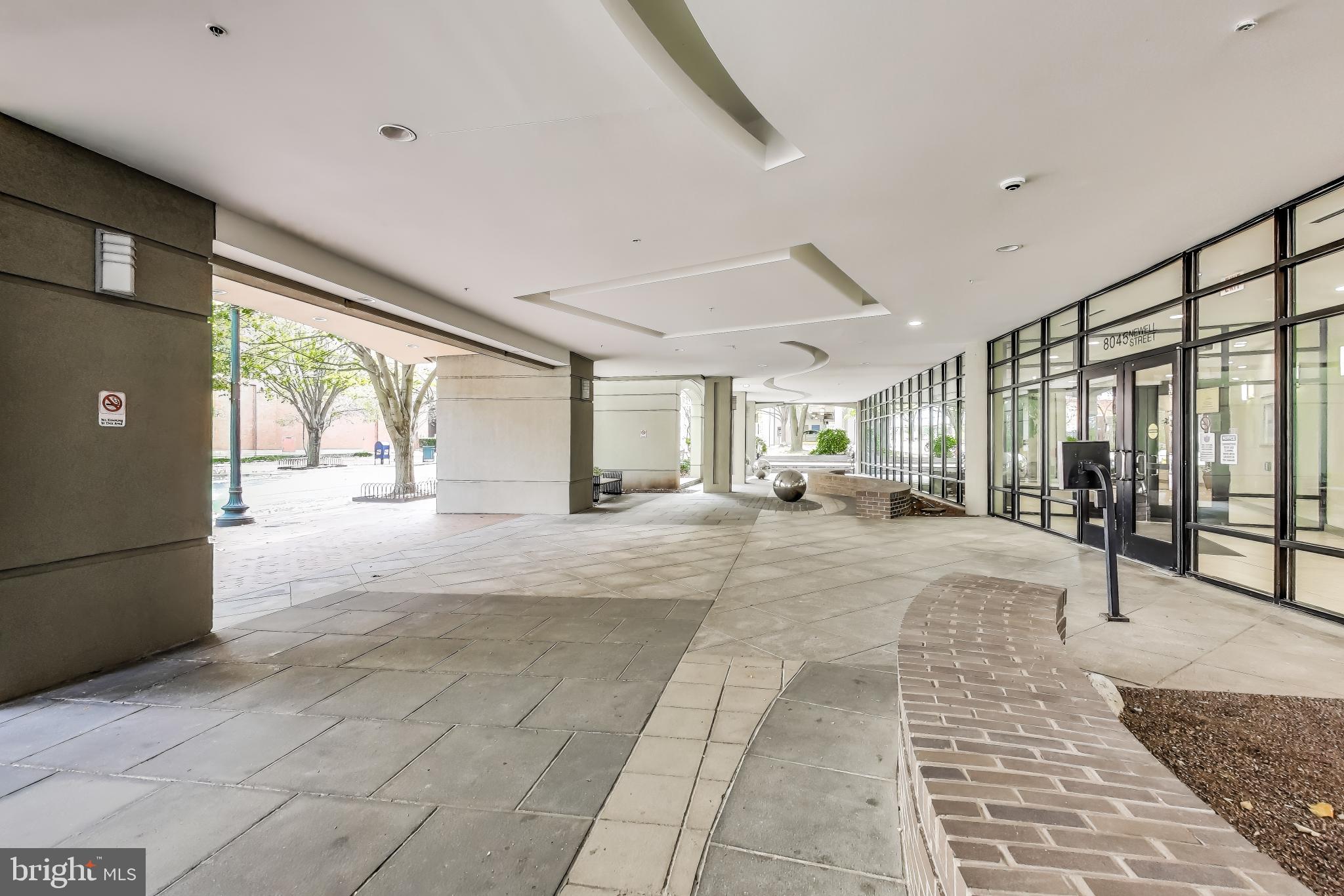 8045 Newell Street, Unit 108 Silver Spring, MD 20910 - Photo 22 of 33 a view of hallway with furniture and a rug