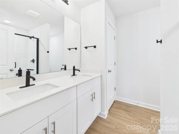 a bathroom with a double vanity sink