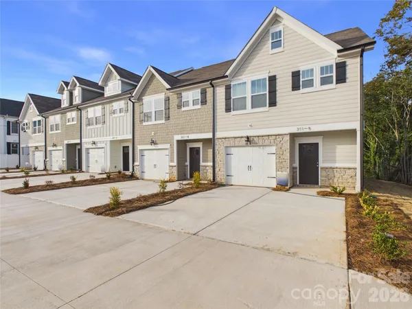 a view of a white house with a outdoor space
