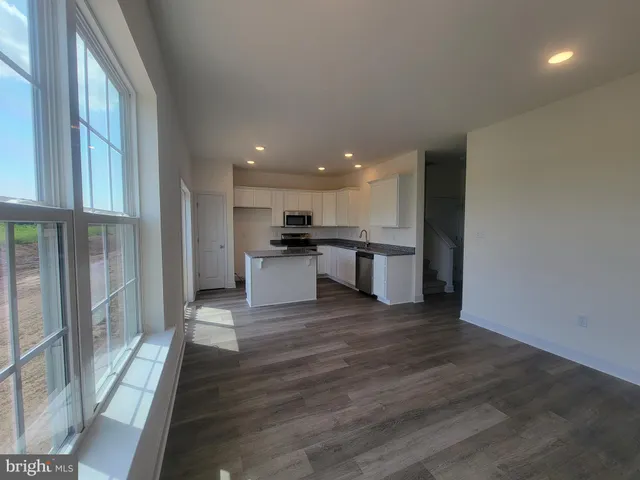 a view of kitchen with wooden floor