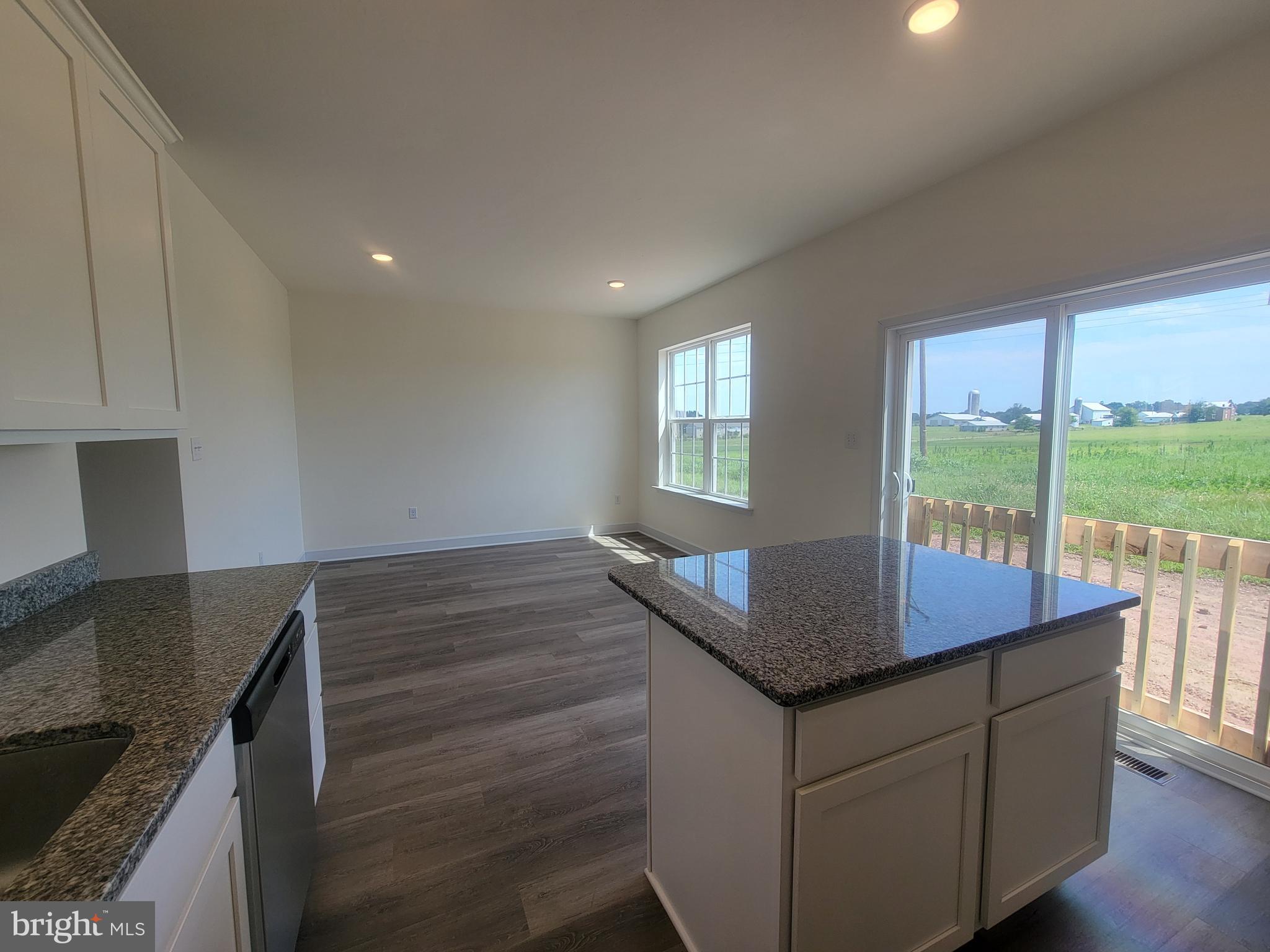 3801 Castle Drive Dover, PA 17315 - Photo 7 of 22 a kitchen with kitchen island a sink table and chairs
