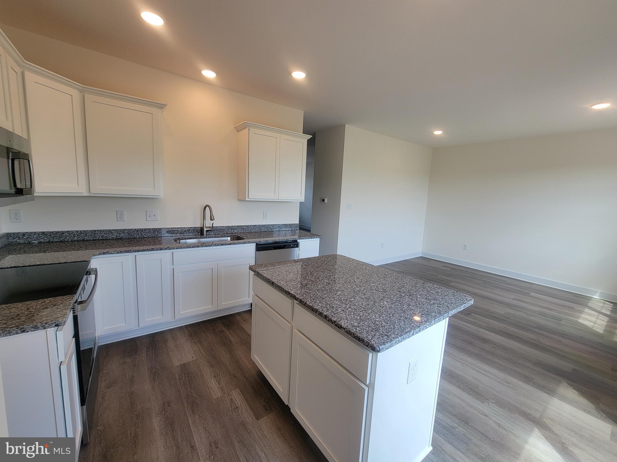 3801 Castle Drive Dover, PA 17315 - Photo 8 of 22 a kitchen with a sink stove and cabinets