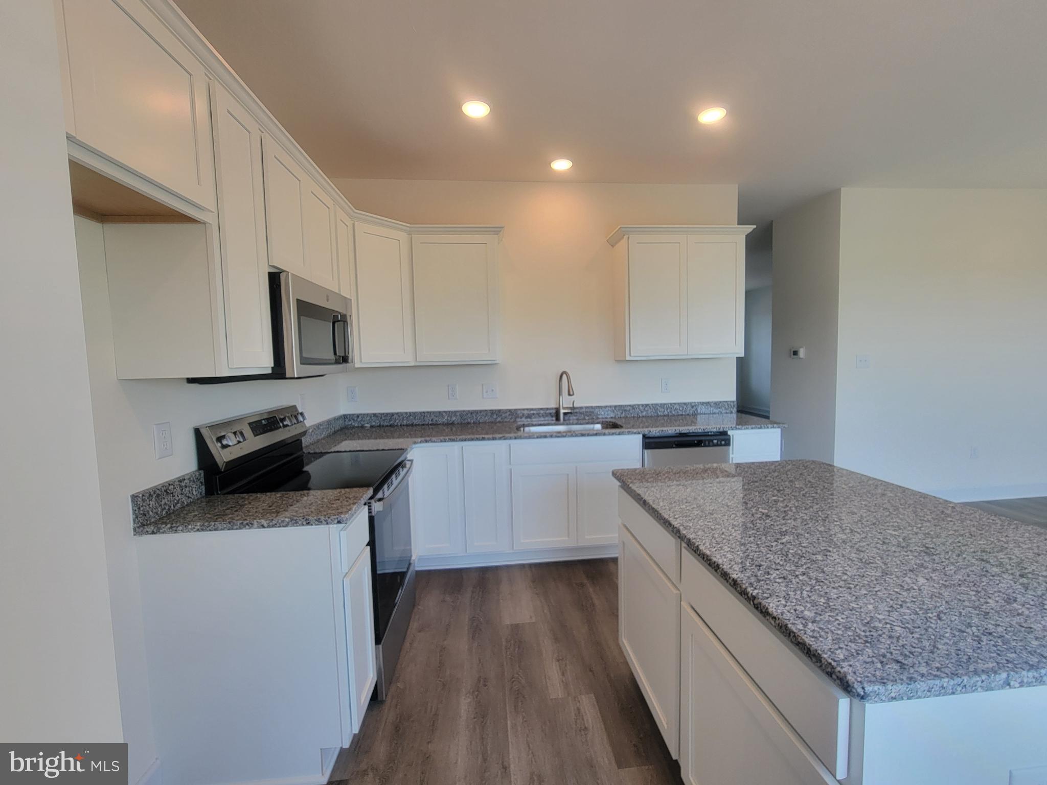 3801 Castle Drive Dover, PA 17315 - Photo 9 of 22 a kitchen with a sink stove and microwave