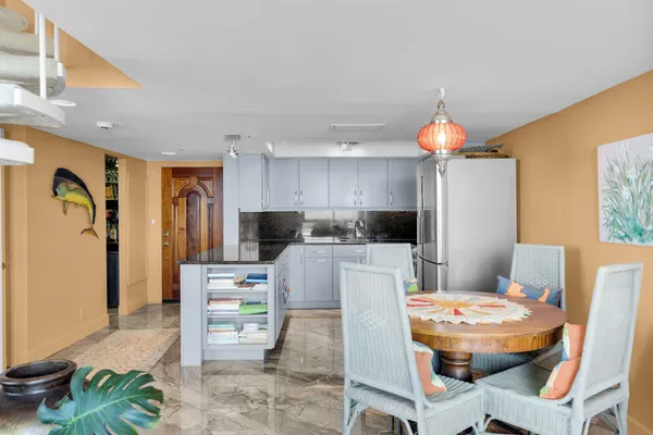 a living room filled with furniture and a large window