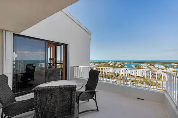a bedroom with furniture and a flat screen tv