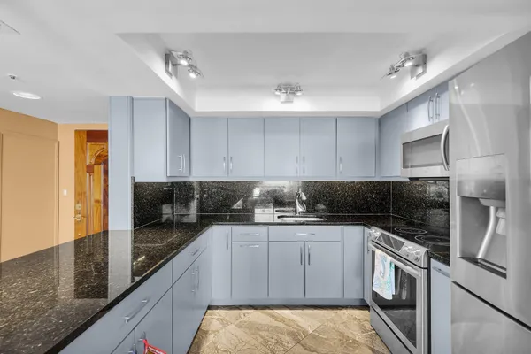 a kitchen with a sink and cabinets